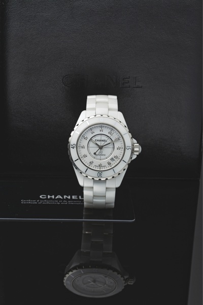 CHANEL J12 STEEL WHITE CERAMIC DIAMOND.Chanel, Paris, J12 Automatic 200M, Ref. J.M. 96478. Made.circa 2005..Very fine, curved, center seconds, self-winding, waterresistant.stainless steel, ceramic and diamonds.wristwatch with date and a white