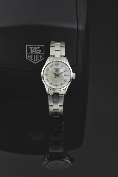TAG HEUER REF. WV1411.CARRERA QUARTZ STEEL DIAMOND.Tag Heuer, Swiss, Carrera, No. EEH1908, Ref. WV 5111..Made circa 2005..Fine, center seconds, water-resistant, stainless steel.and diamonds quartz wristwatch with date and a Tag.Heuer stainles