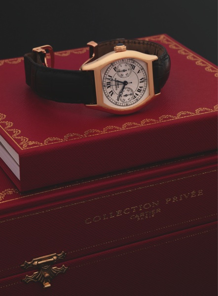 CARTIER REF. 2356 TORTUE CHRONOGRAPH YELLOW GOLD.Cartier, Swiss, Tortue Chronograph, No. 0190 CC, Ref. 2356. Made in 2001..Very fine, tonneau-shaped, water resistant, 18K yellow gold wristwatch with single button chronograph, register and.an 18
