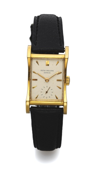 PATEK PHILIPPE REF. 2456 YELLOW GOLD.Philippe, Genève, No. 974474, case No. 669895, Ref. 2456..Made in 1950..Very fine and rare, rectangular curved, flared, 18K yellow.gold wristwatch.