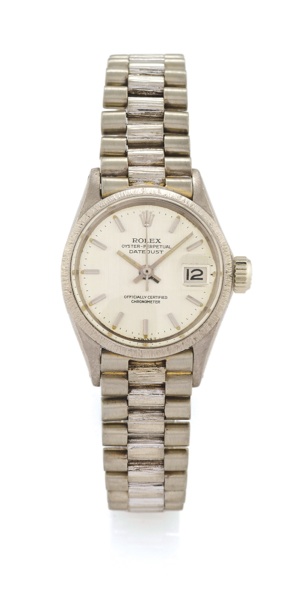 ROLEX REF. 6527 LADY DATEJUST WHITE GOLD.Rolex, Oyster Perpetual DateJust, Officially Certified Chronometer, case No. 1469507, Ref. 6527/6517. Made in 1966. Fine, center-seconds, self-winding, water resistant, bark-finish 18K white gold lady’s 