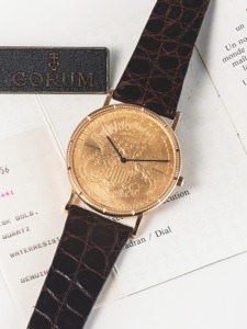 CORUM 20 DOLLAR COIN WATCH. Corum, “Coin Watch,” No. 275791, case No. 440441. Made in. the 1990’s.. Fine, 18K yellow gold wristwatch inserted in a $20 US. gold coin dated 1907 with gold plaque Corum buckle.. Accompanied by certificate and hang tag.