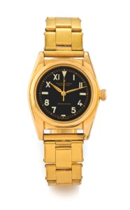 Rolex Ref 5015 Bubbleback - Black. California Dial. Rolex, “Oyster Perpetual Chronometre”, Ref. 5015. Made. circa 1950.. Fine and rare, tonneau-shaped, center seconds, selfwinding. water-resistant, gold-plated and stainless steel. wristwatch with a gold-p