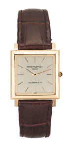 PATEK PHI LIPPE. REF.3490 YELLOW GOLD. Patek Philippe, Retailed by Hausmann co, No.1130681. case No. 2633581, Ref. 3490. Made in the 1960s.. Fine, flat, square, 18K yellow gold wristwatch.