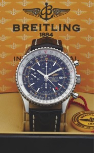 BREITLING REF. A 24322 NAVITIMER WORLD STEEL. Breitling, Genève, Navitimer, Chronograph, Chronometer, No.. 754473, Ref. A 24322. Made circa 2007.. Fine and rare, two time zone, stainless steel chronometer. wristwatch with date, 24-hour hand, round button 
