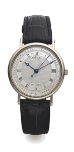 BREGUET REF. 5917 WHITE GOLD. Breguet, “Automatic,” No. 1862, Ref. 5917. Made in the. 1990s.. Very fine and elegant, self-winding, center seconds, 18K. white gold wristwatch with date and an 18K white gold. Breguet buckle.