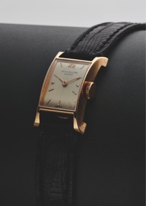 PATEK PHILIPPE REF. 2295. MINI PAGODA PINK GOLD. Patek Philippe Cie, Genève, No. 946099, case No.. 673023, Ref. 2295. Made circa 1950.. Fine and very rare, rectangular domed, flared, “Pagoda”. shaped, 18K pink gold lady’s wristwatch with an 18K pink. go