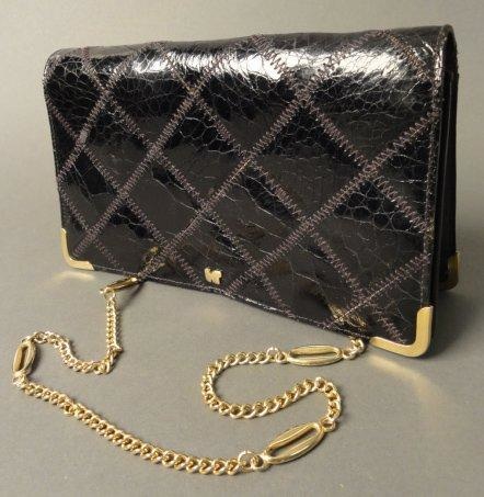 Nina RICCI Nina RICCI Sac à main en crocodile noir Avec une petite chaînette pour - vente aux enchères 12/06/2013
