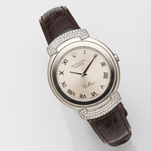 Cellini, Ref:6682, Serial No.A99****, Circa 1998 8-jewel Cal.6620 quartz movement, sunburst pink dial with applied polished Roman numerals, polished lance hands, polished round case with snap on back, hinged diamond set shoulders, fitted burgundy Rolex le