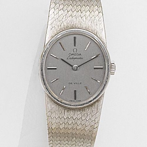Omega. A lady's 18ct white gold automatic bracelet watch