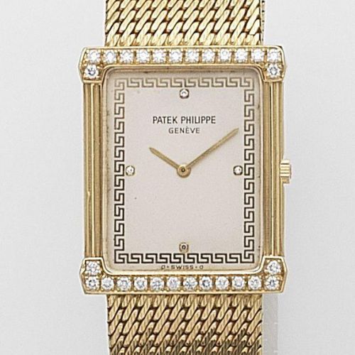 Patek Philippe. An 18ct gold and diamond set manual wind bracelet watch