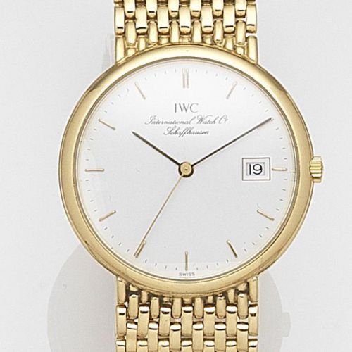 IWC. An 18ct gold quartz calendar bracelet watch