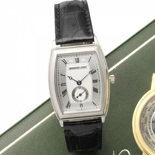 Breguet. An 18ct gold automatic tonneau shaped wristwatch