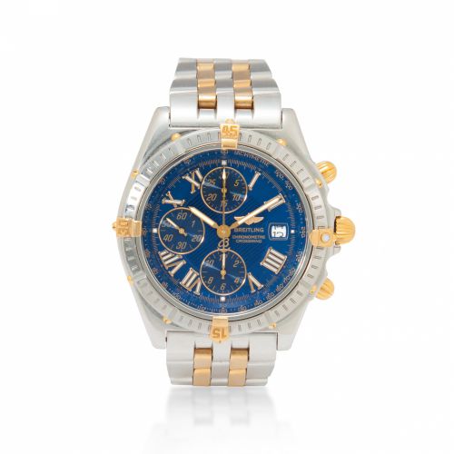 Breitling. A stainless steel and gold automatic chronograph wristwatch with bracelet
