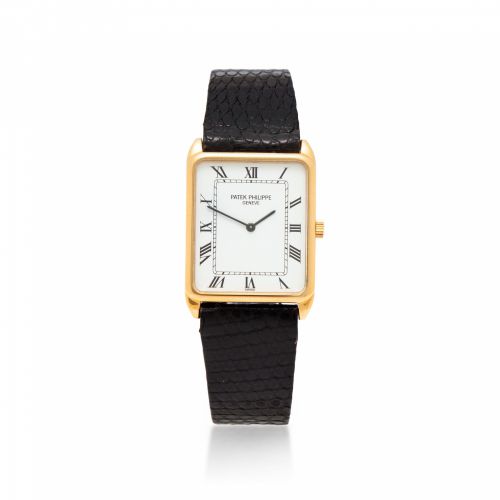 Patek Philippe. A fine 18K gold tank style wristwatch