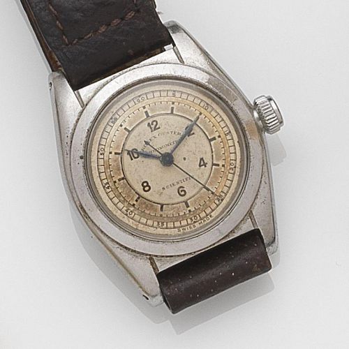 Rolex. A stainless steel manual wind wristwatch