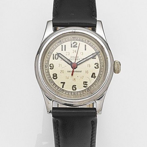Rolex. A stainless steel manual wind wristwatch