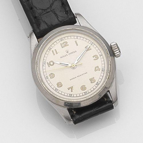 Rolex. A stainless steel manual wind wristwatch