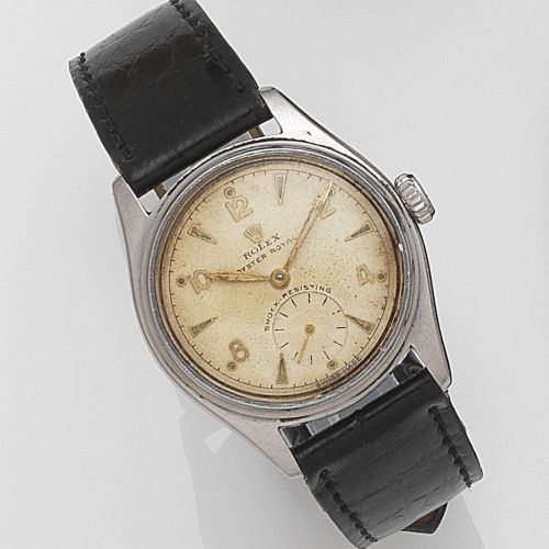 Rolex. A stainless steel manual wind wristwatch