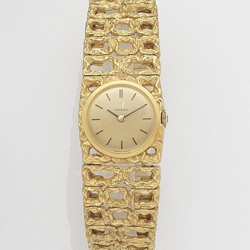 Omega. A lady's 18ct gold manual wind bracelet watch