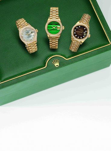 Rolex. A lady's 18ct gold and diamond set automatic calendar bracelet watch