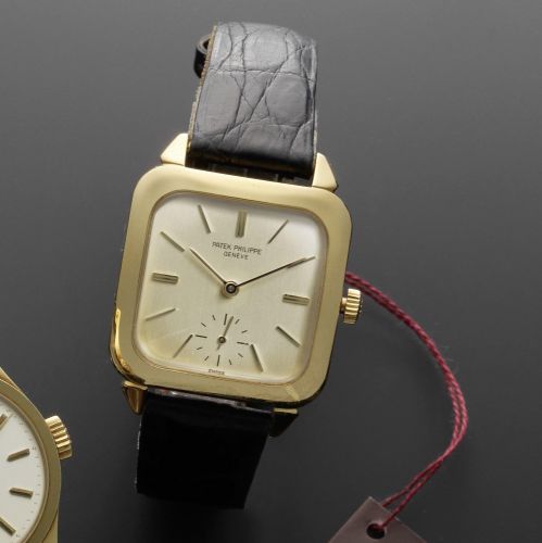 Patek Philippe. A fine 18ct gold automatic cushion cased wristwatch