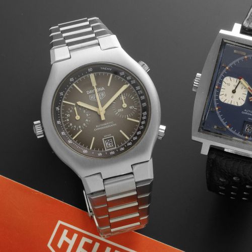Heuer. A stainless steel automatic chronograph bracelet watch together with papers