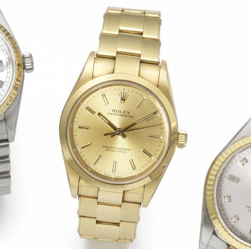 Rolex. An 18ct gold automatic bracelet watch with certificate