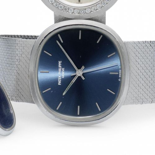 Patek Philippe. An 18ct white gold automatic bracelet watch with matching cufflinks