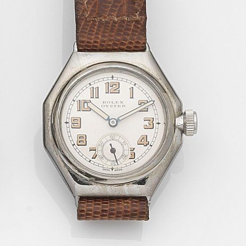 Rolex. A stainless steel manual wind wristwatch