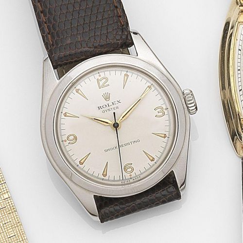 Rolex. A stainless steel manual wind wristwatch