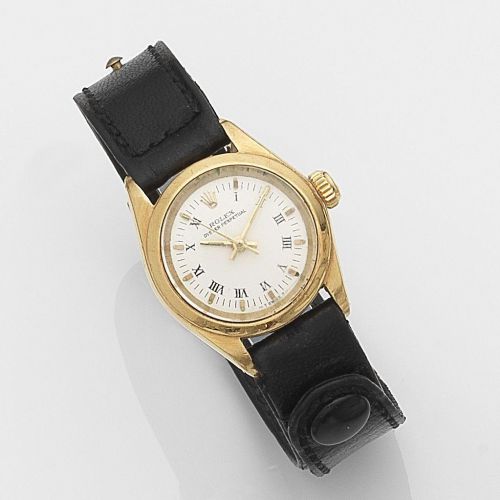 Rolex. A lady's 18ct gold automatic wristwatch