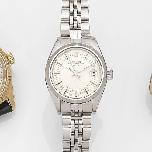 Rolex. A lady's stainless steel automatic calendar bracelet watch