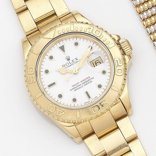 Rolex. An 18ct gold automatic calendar bracelet watch