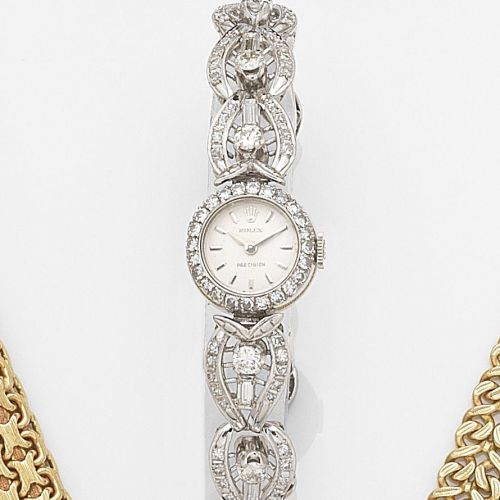 Rolex. A lady's 18ct white gold and diamond set manual wind cocktail watch