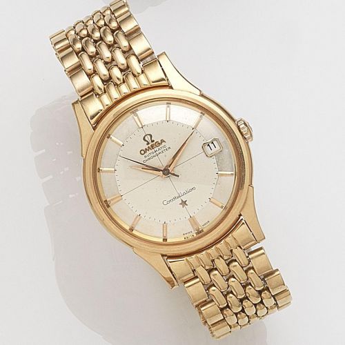 Omega. An 18ct gold automatic calendar bracelet watch