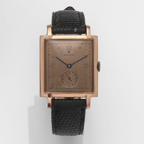 Rolex. A rose gold plated and stainless steel manual wind wristwatch