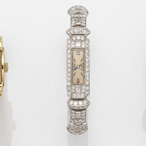 Swiss. A lady's platinum and diamond set manual wind cocktail watch