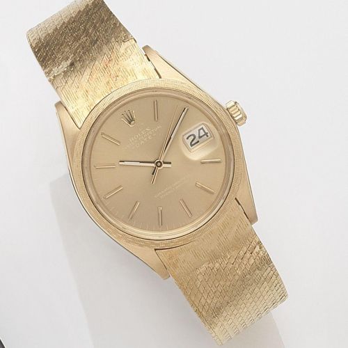 Rolex. An 18ct gold automatic calendar bracelet watch
