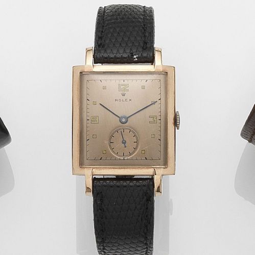 Rolex. A rose gold plated and stainless steel manual wind wristwatch