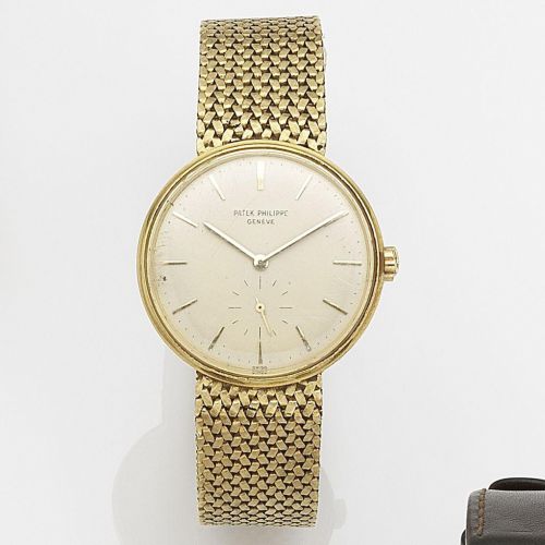 Patek Philippe. An 18ct gold automatic bracelet watch