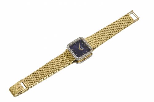 Patek Philippe. An 18K gold bracelet watch with diamond bezel