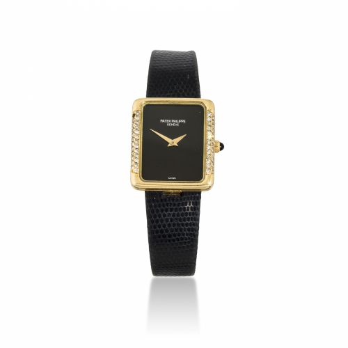 Patek Philippe. A fine 18K gold lady's wristwatch set with diamonds