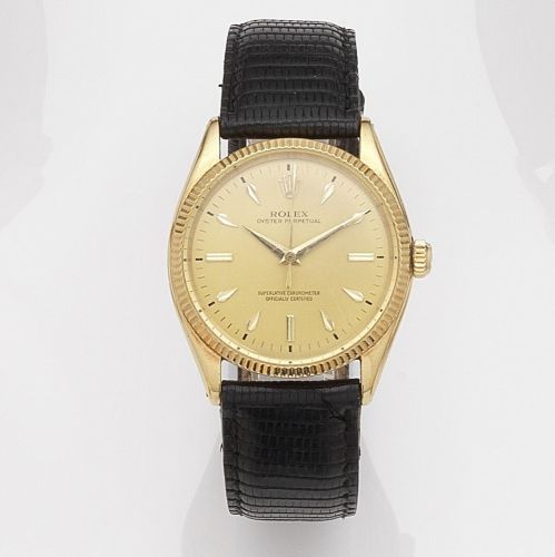 Rolex. An 18k gold automatic wristwatch