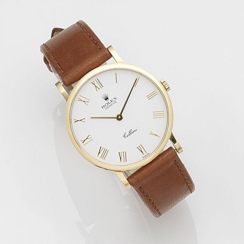 Rolex. An 18k gold manual wind wristwatch