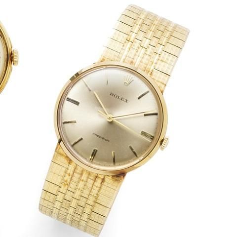 Rolex. An 18K gold manual wind bracelet watch