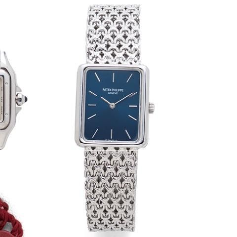 Patek Philippe. A lady's 18K white gold manual wind bracelet watch