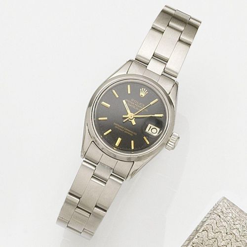 Rolex. A stainless steel automatic calendar bracelet watch