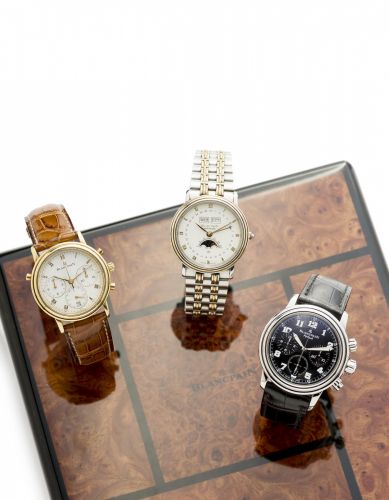 Blancpain. An 18K gold and stainless steel automatic annual calendar moon phase bracelet watch with box and paper