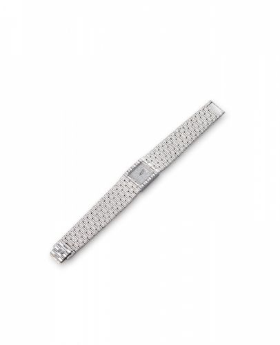 Piaget. A lady's 18K white gold and diamond set quartz bracelet watch with box and papers